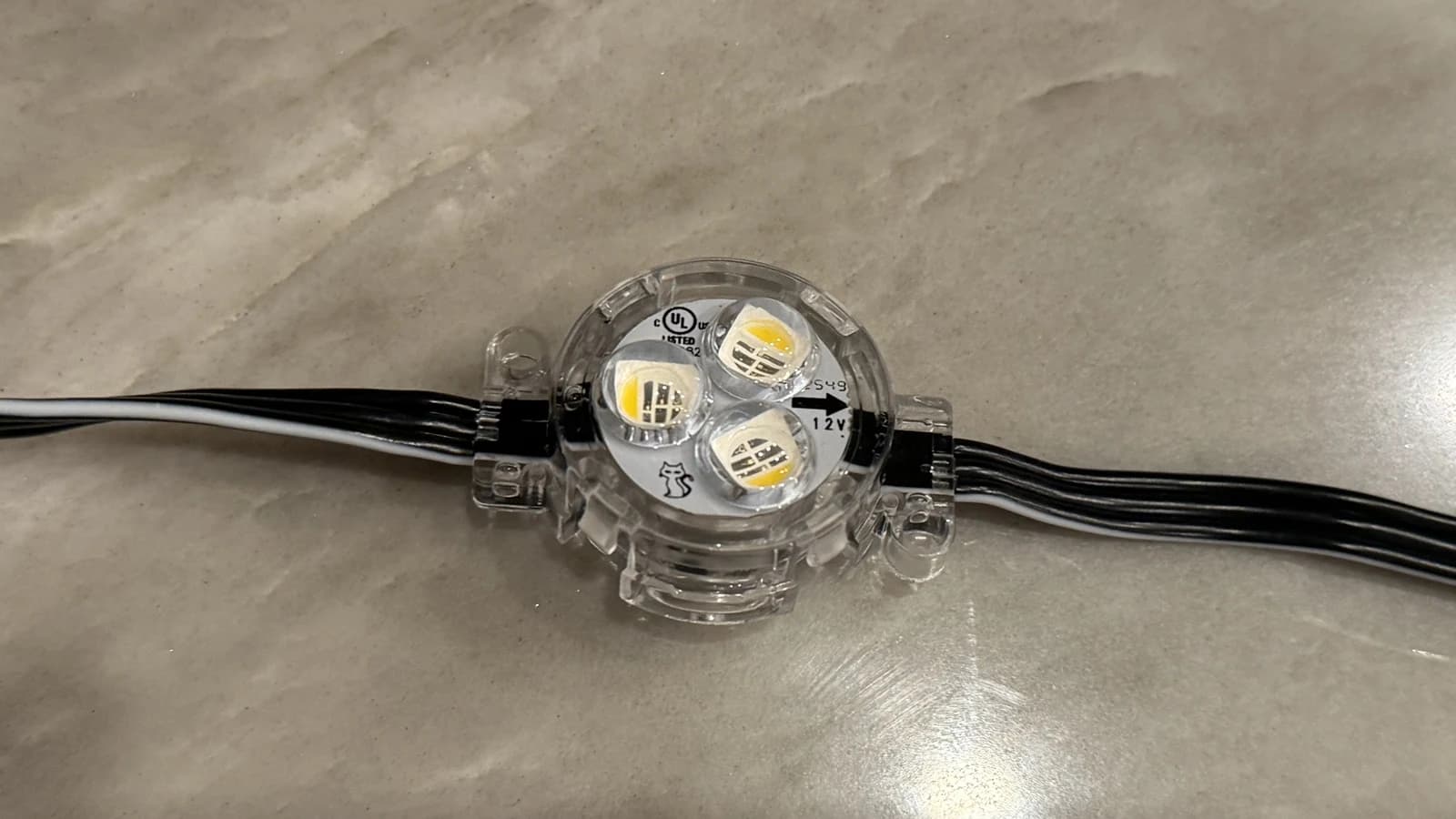 Top view of a Bosso 12V node with three lens-covered emitters