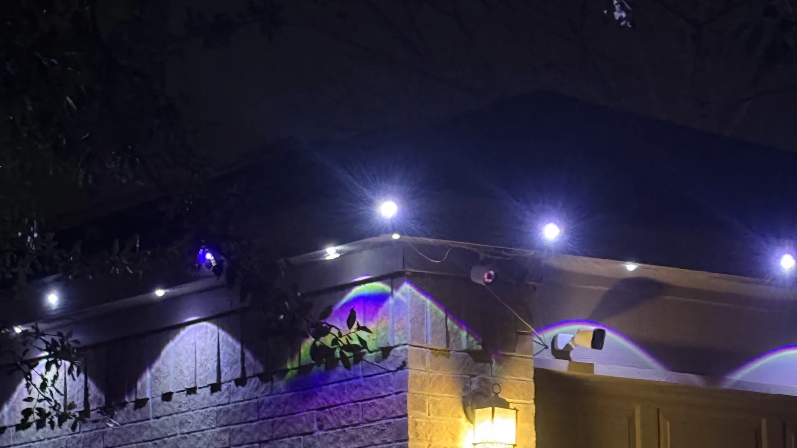 Close view of Govee lights and the projected arcs beneath a roofline